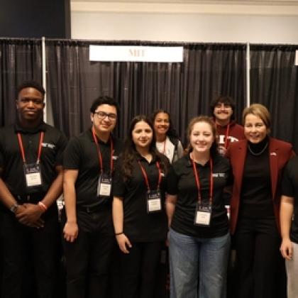 MIT robotics club students pose together.